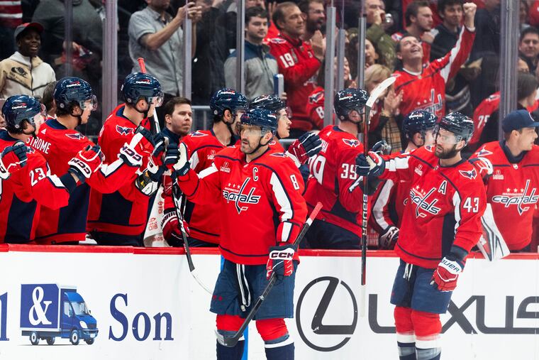 Washington Capitals left wing Alex Ovechkin (8), followed by right wing Tom Wilson (43), is congratulated for his goal on Friday night.