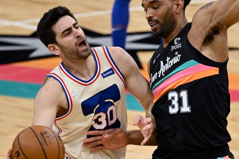 The 76ers' Furkan Korkmaz (30) collides with the San Antonio Spurs' Keita Bates-Diop during the second half.