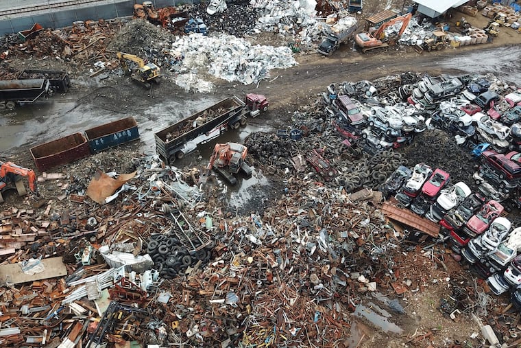 Metal is loaded onto a truck at a junkyard at 2200 East Somerset Street, Philadelphia, Pa. Wednesday August 1, 2018.