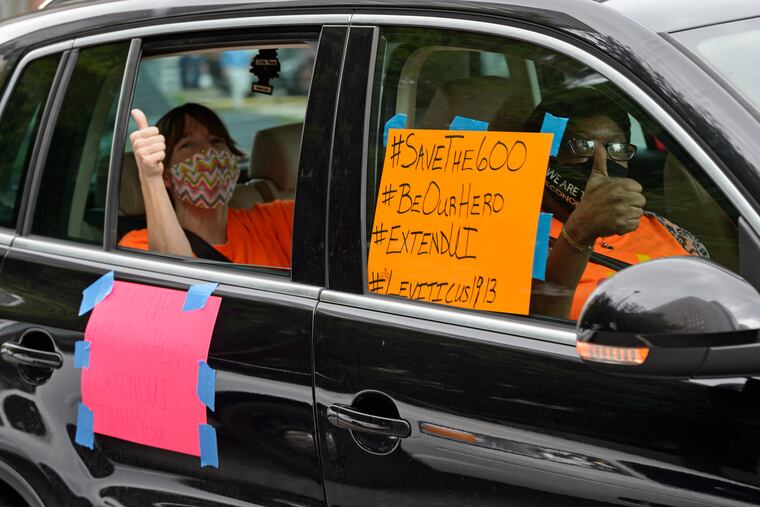 In this July 22 photo, motorists took part in a caravan protest in front of Senator John Kennedy's office at the Hale Boggs Federal Building in New Orleans asking for the extension of the $600 in unemployment benefits to people out of work because of the coronavirus.