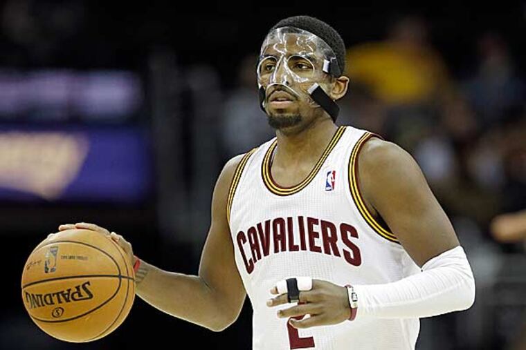 Cleveland Cavaliers' Kyrie Irving brin gs the ball up against the Toronto Raptors in an NBA basketball game Tuesday, Dec. 18, 2012, in Cleveland. (Mark Duncan/AP)