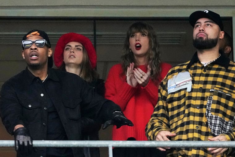 Taylor Swift (center) watches the Kansas City Chiefs and her boyfriend, Travis Kelce, beat the Baltimore Ravens in the AFC championship game at M&T Bank Stadium.