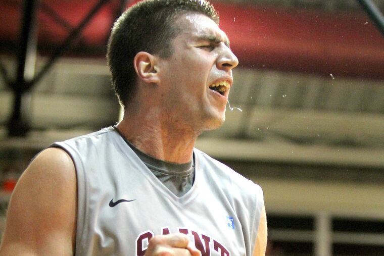 Hawks’ Halil Kanacevic celebrates three-point play in first half.