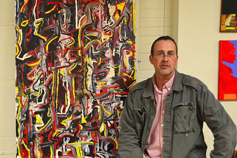 Vince Sangmeister poses next to a painting that he created while participating in Project H.O.M.E.'s art program. Monday, October 13, 2014. (C.F. Sanchez / Staff Photographer)