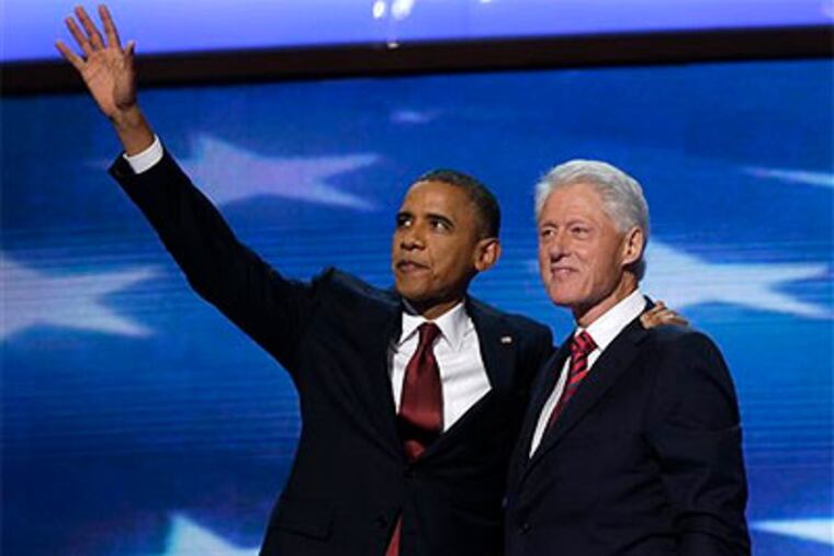 President Barack Obama waves as he joins Former President Bill Clinton during the Democratic National Convention in Charlotte, N.C., on Wednesday, Sept. 5, 2012. (AP Photo / Charles Dharapak)