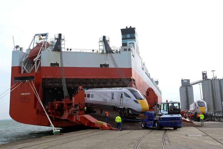 A Class 800 Intercity Express train, produced by Hitachi Ltd., is unloaded from the Tamerlane roll-on, roll-off transporter ship, operated by Wallenius Wilhelmsen, at the Port of Southampton in England. The five-car train produced for the Great Western route is one of 12 to be built at Hitachi's Kasado Works, with the remaining 110 to be manufactured at the company's new Newton Aycliffe site in the U.K.