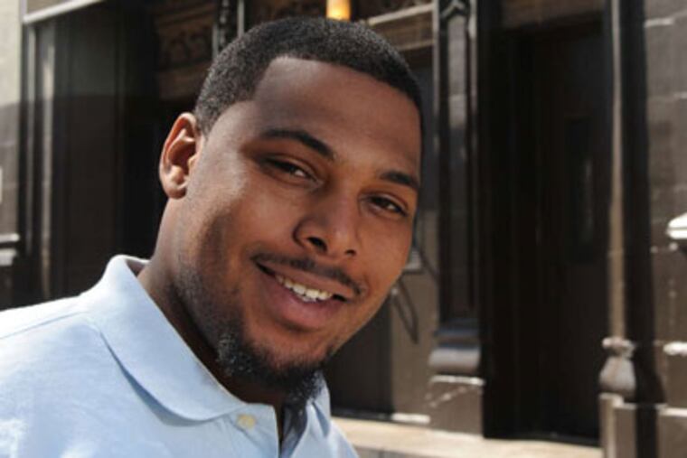 Tazhe Cooper, 20, outside Horace Howard Furness High in South Philadelphia, where he graduated in 2009. (Clem Murray / Staff Photographer)
