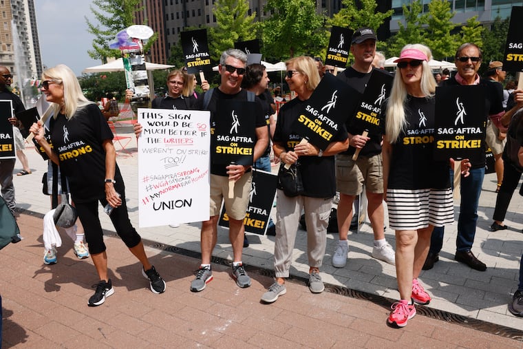 Members of SAG-AFTRA strike in Center City at Love Park on July 20, just a few blocks from Comcast's center city headquarters.