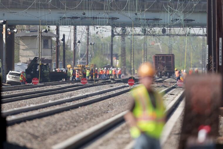 Crews work at the scene of a Norfolk Southern freight train derailment in Ridley Park. The derailment has affected service on both Amtrak and SEPTA trains.