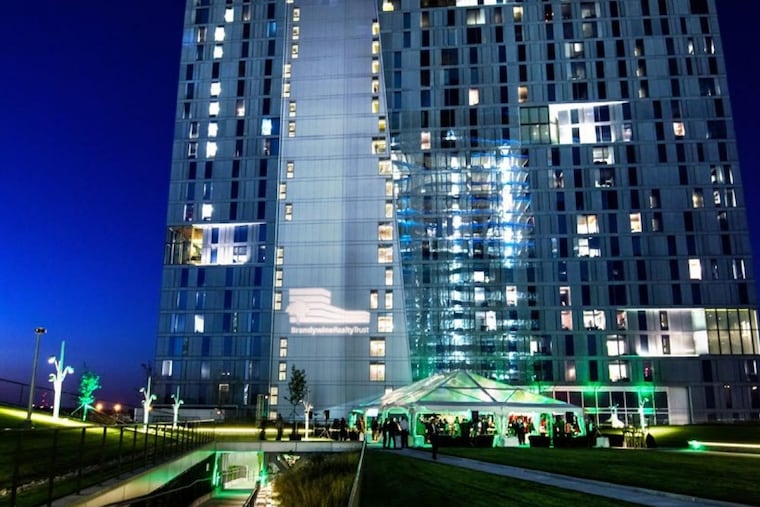 Evo at Cira Centre South student housing tower, as seen from Cira Green public space atop adjacent parking garage.