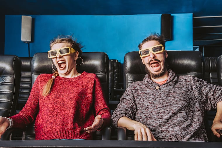 A couple watches a 4D movie.