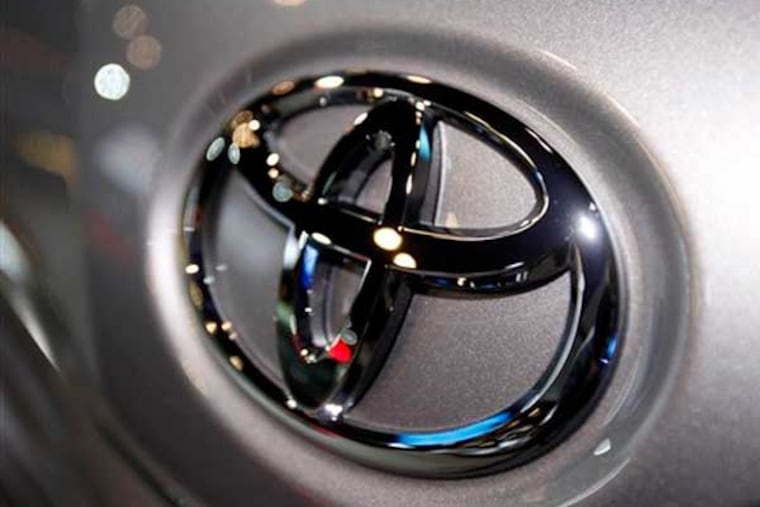 FILE - This March 31, 2010 file photo shows the Toyota logo on a car at the New York International Auto Show in New York. Toyota Motor Corp. officials say the company has settled what was to be the first in a group of hundreds of pending wrongful death and injury lawsuits involving sudden, unintended acceleration by Toyota vehicles. (AP Photo/Seth Wenig, File)