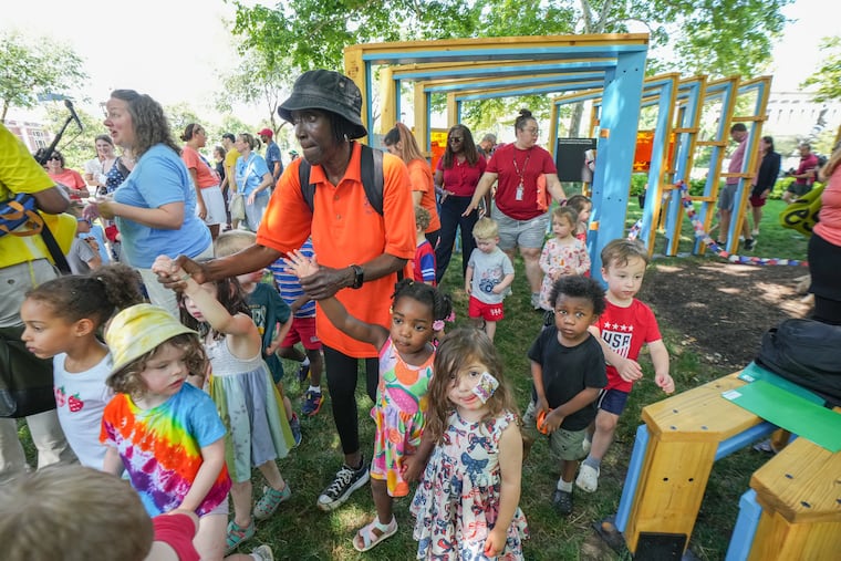 Retired Pre-School teacher Teresa Quillen, who taught at Friends Child Care Center, walks through the new playful learning hub at Sisters Cities Park in Philadelphia, June 11, 2026.
