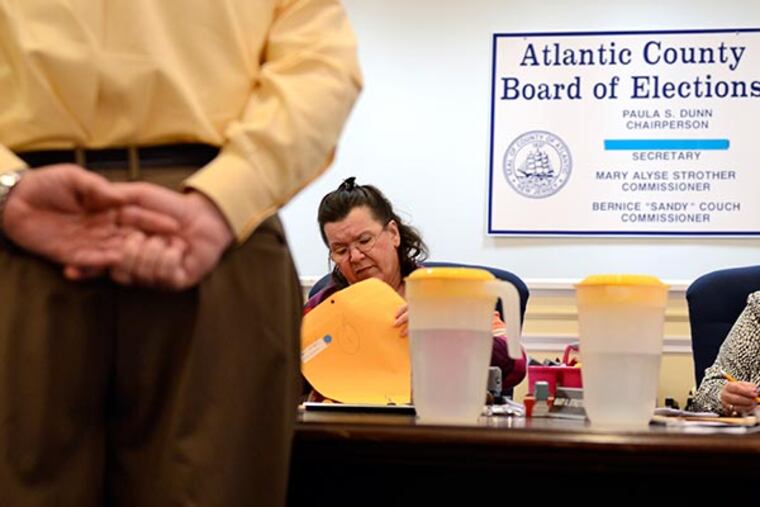 Atlantic County Board of Elections chair Paula Dunn continues recounting mail in ballots in the contested Second District Legislative Race between Democratic challenger Vince Mazzeo and Republican incumbent John Amodeo in a courtroom in Mays Landing December 3, 2013. ( TOM GRALISH / Staff Photographer )