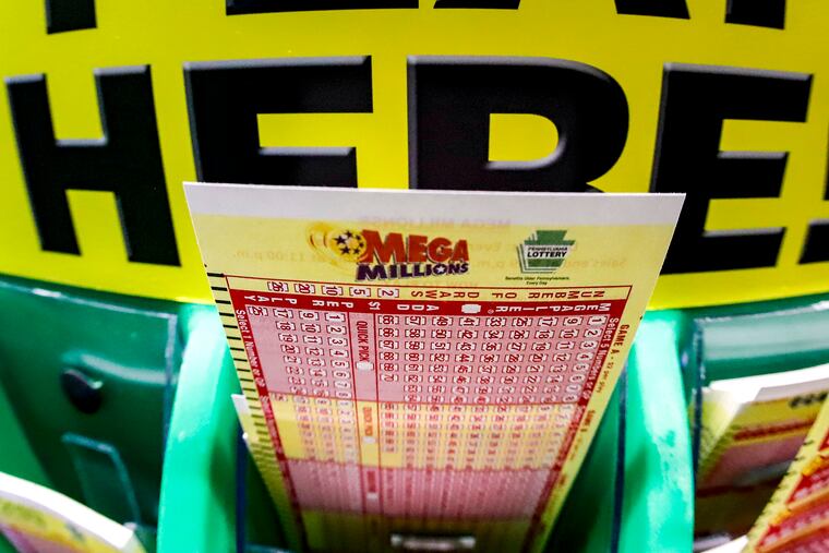A Mega Millions play-slip for those players preferring to choose the numbers they want to play is among the stacks of other lottery game play-slips displayed in Cranberry Township, Pa., Friday, Jan. 22, 2021. Lottery officials have raised the Mega Millions grand prize to $660 million Thursday, July 21, 2022, giving players a shot at the nation's ninth largest jackpot. The prize for Friday night's drawing has grown large because there hasn't been a winner in three months, from its $20 million starting point in April.