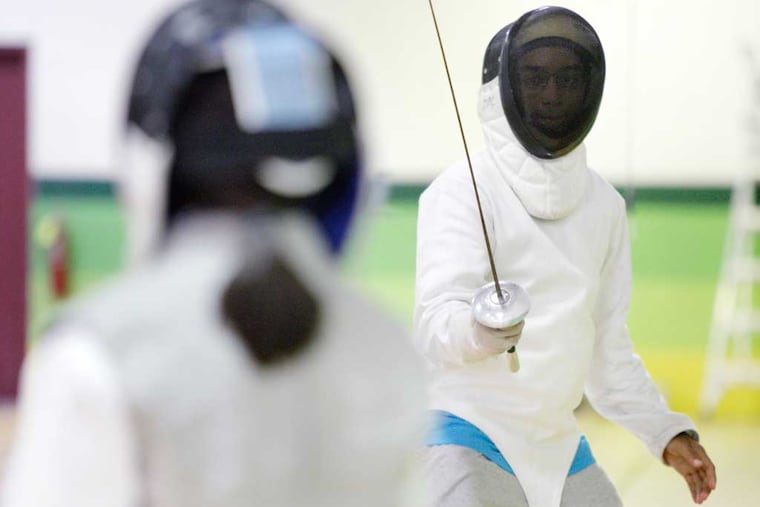 Effren Leventhal, 14, of Lower Gwynedd, spars during class at Delaware Valley Fencers. (ELIZABETH ROBERTSON / Staff Photographer)