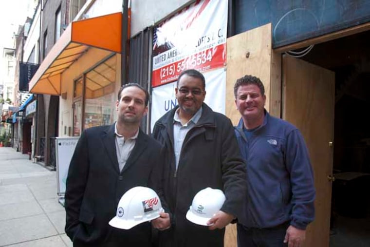 Michael Brown, center, CEO of Environmental Construction Services with his Sheet Metal Superintendent Matt Rispo, left, and Rich Podulka, Director of Business Development for United American Builders Inc. outside one of their projects , Good Stuff Eatery on South 18th Street in Center City. ( ED HILLE / Staff Photographer )