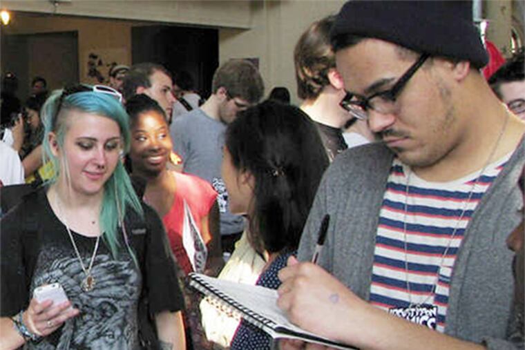 Visitors at the 2013 comics festival . This year's marks release of Locust Moon's new publication. Rob McMonigal