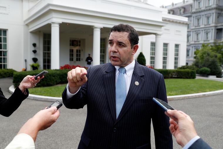 FILE - In this Sept. 13, 2017, file photo, Rep. Henry Cuellar (D., Texas) speaks with reporters outside the West Wing after a bipartisan meeting with President Donald Trump at the White House, in Washington. Kristie Small, a former senior aide to Cuellar, filed a lawsuit against the Texas Democrat in Washington on Monday that claims she was wrongly fired for being pregnant. The lawsuit argues Cuellar's firing of Small was both sex and pregnancy discrimination in violation of the Congressional Accountability Act of 1995.