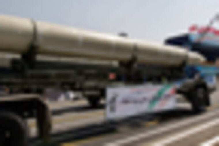 A Qiam missile is displayed by Iran's Revolutionary Guard, during a military parade commemorating the start of the Iraq-Iran war 32 years ago, in front of the mausoleum of the late revolutionary founder Ayatollah Khomeini, just outside Tehran, Iran, Friday, Sept. 21, 2012. (AP Photo/Vahid Salemi)