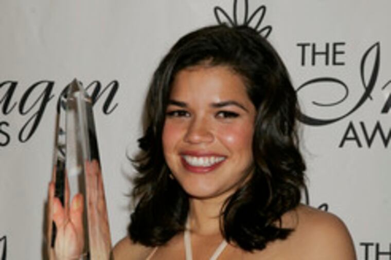 of "Ugly Betty," with her award.