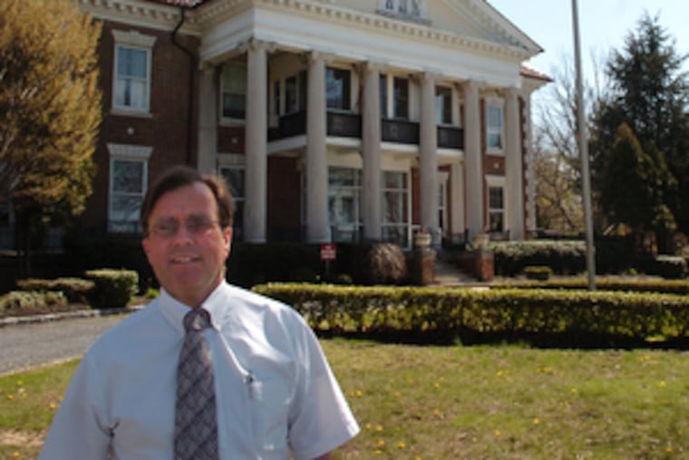 Mayor Fern Oullette at Delanco's taxes-sapping Zurbrugg mansion. A long-awaited developer's plans need township and court approval.