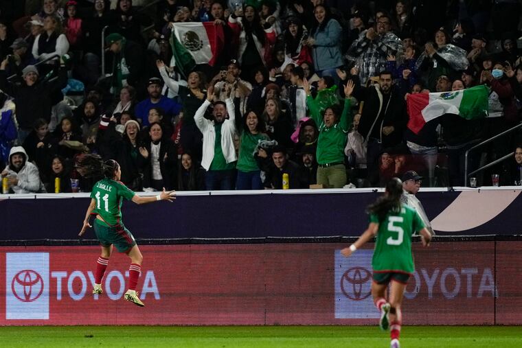 Jacqueline Ovalle (left) celebrates scoring Mexico's first goal of the game.