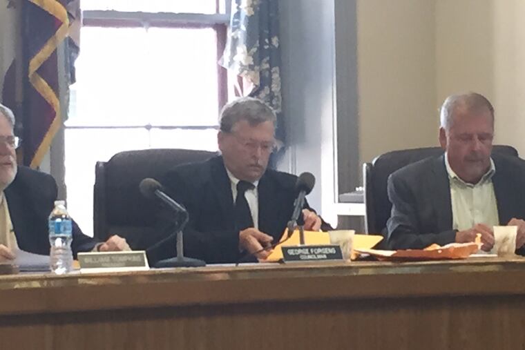 George Forgeng at a council meeting. He was cleared of charges after shooting a bank robbery suspect.