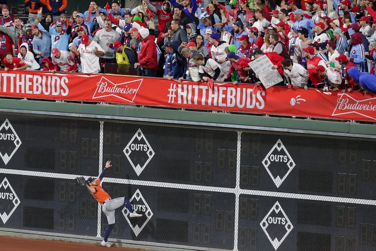 Houston Astros center fielder Chas McCormick catches a long hit by Philadelphia Phillies catcher J.T. Realmuto at the wall in the ninth inning of Game 5 of the World Series.