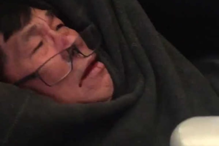 Screen grab of a video by Twitter user @JayseDavid showing Dr. David Dao being forcibly removed from an overbooked United Airlines flight.