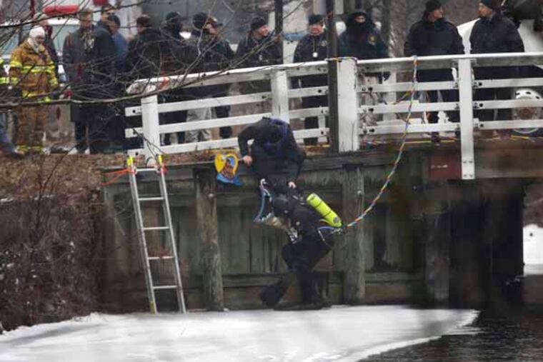 A diver prepares to enter the Delaware and Raritan Canal during a search for missing person Sarah Majoras Monday, Jan. 28, 2013, in Lambertville, N.J. The Hunterdon County Prosecutor's Office says 39-year-old Majoras had left a bar in New Hope, Pa., and was last seen crossing the bridge into Lambertville, N.J., at 2 a.m. Saturday. A search of the Delaware River by divers and by volunteers on land has failed to find a sign of the woman. (AP Photo/Matt Rourke)