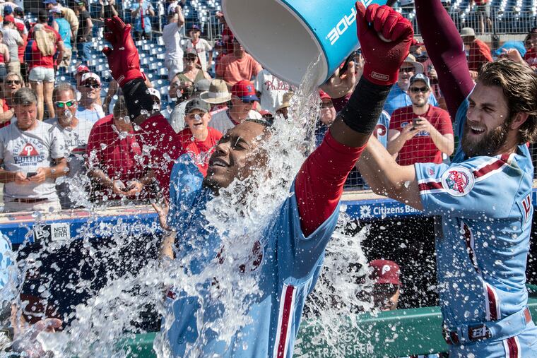 Bryce Harper douses Jean Segura after the shortstop's walk-off home run.