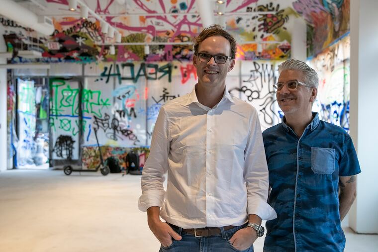 Robert Perry (right) and Christian Dalzell inside the new event space and coworking space at 514 South St. Dalzell teamed up with Perry, whose Tattooed Mom tavern was the inspiration behind the design of the new space.