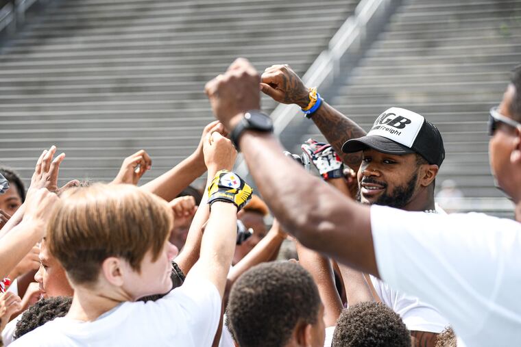 Eagles running back Miles Sanders at his youth football camp at Woodland Hills’ stadium in Pittsburgh. Sanders played high school football there.