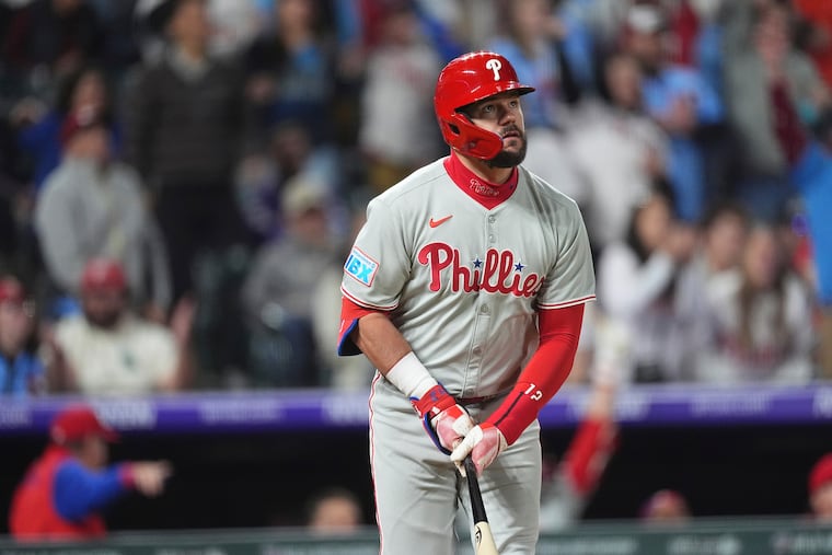 The Phillies' Kyle Schwarber watches his home run leave the park in the ninth inning of a 9-3 win over the Rockies on Monday.