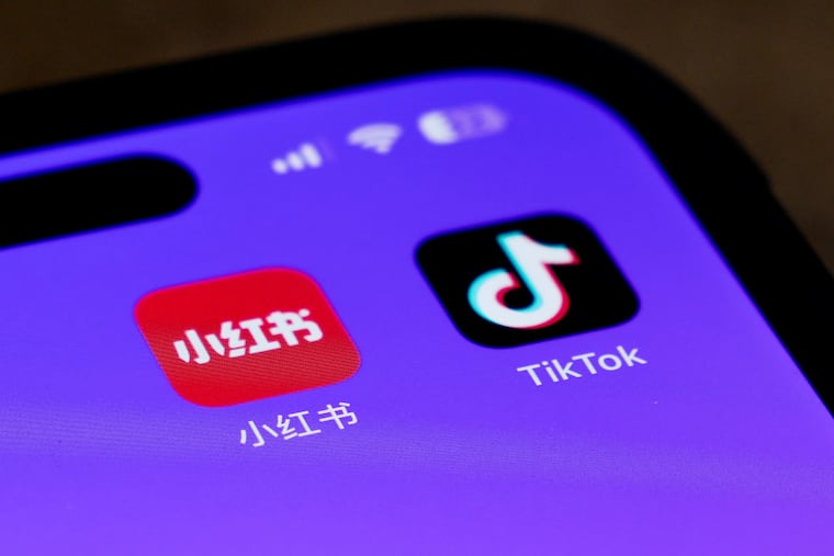 Icons for the smartphone apps Xiaohongshu and TikTok are seen on a smartphone screen in Beijing this week.