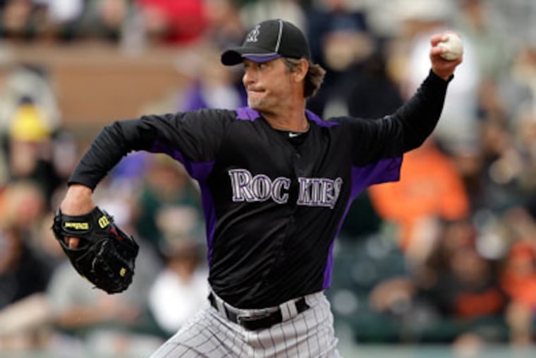 Colorado Rockies pitcher Jamie Moyer throws to the San Francisco Giants during a spring training game. (AP Photo/Marcio Jose Sanchez)