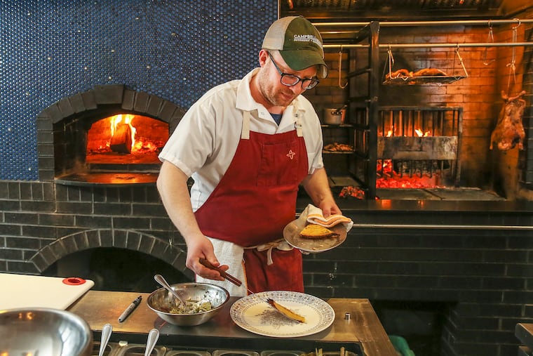 Fiore Fine Foods, 757 S Front St., chef/co-owner Ed Crochet working on the farinata with artichokes; Friday, April 26, 2019