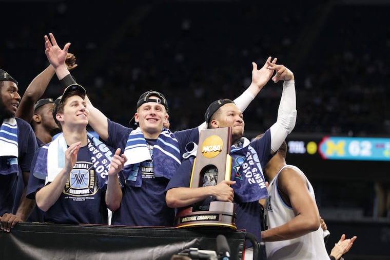 Collin Gillespie (left), Donte DiVincenzo (center), and Jalen Brunson celebrating Villanova’s national championship Monday night.