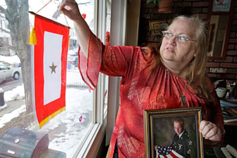 The abridged Army investigation into a battle at an Afghan outpost was little comfort to Cynthia Woodard, who surrounds herself with memories of her 22-year-old son. (Elizabeth Robertson / Staff Photographer)