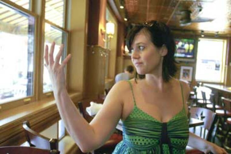 Bridget Foy, owner of Bridget Foy's, a bar and restaurant at 2nd and South St., talks about security concerns on the street. (Ron Tarver / Staff Photographer)