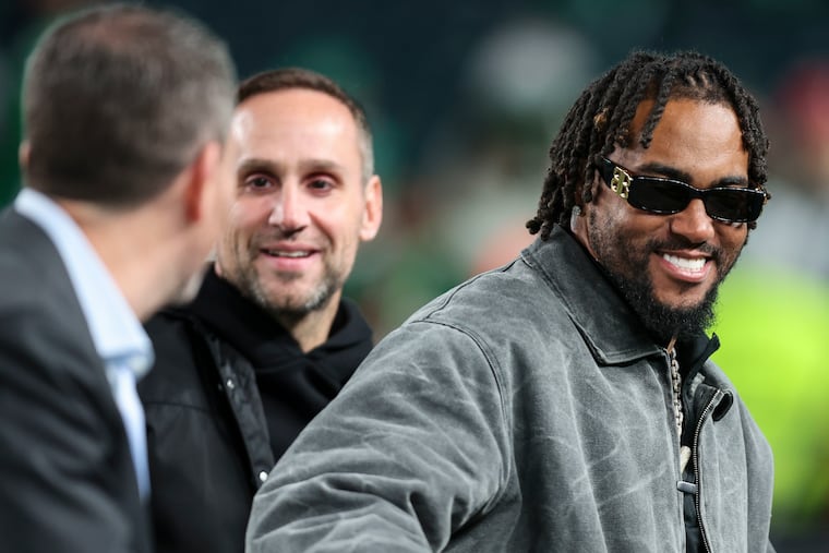 Former Eagles receiver DeSean Jackson (right) talking with general manager Howie Roseman (left) and Fanatics CEO Michael Rubin before a game against the Dolphins on Oct. 22 at Lincoln Financial Field.