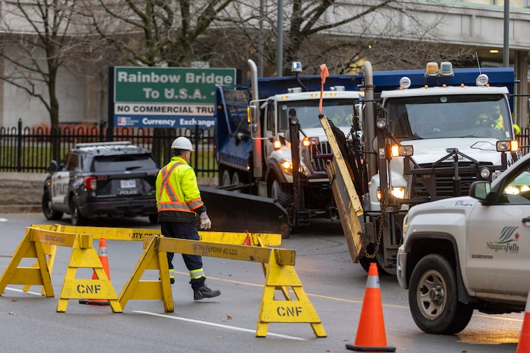 Trucks are positioned to block the entrance to the Rainbow Bridge border crossing between the U.S. and Canada on Wednesday, Nov. 22, 2023, in Niagara Falls, Ontario, after a vehicle exploded at a checkpoint on the American side of the bridge.