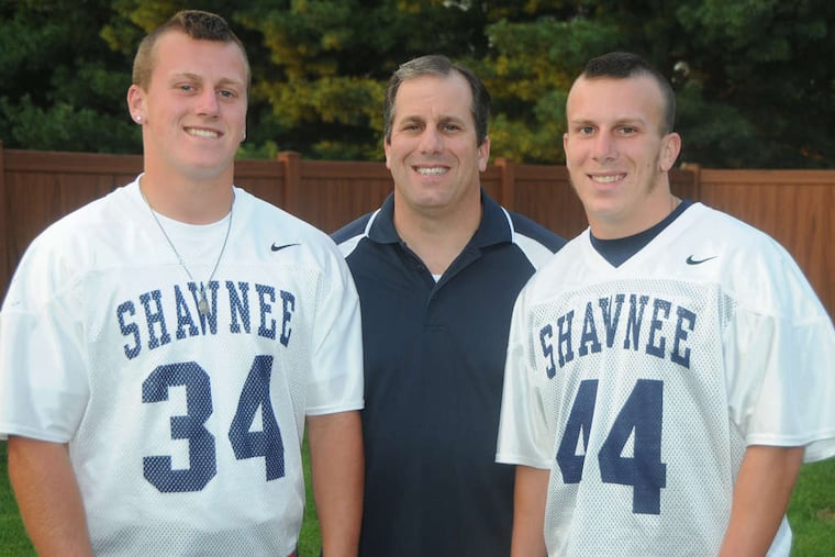 Shawnee stars Anthony DiOrio (left) and brother Rob flank their father, Rob, a former Cherokee star. The boys' mother died of breast cancer when they were young. CURT HUDSON / For The Inquirer