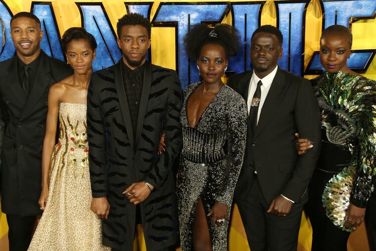 FILE - In this Feb. 8, 2018 file photo, actors Michael B. Jordan, Leitia Wright, Chadwick Boseman, Lupita Nyong'o, Daniel Kaluuya and Danai Gurira pose for photographers upon arrival at the premiere of the film "Black Panther" in London. Boseman, who played Black icons Jackie Robinson and James Brown before finding fame as the regal Black Panther in the Marvel cinematic universe, has died of cancer. His representative says Boseman died Friday, Aug. 28, 2020 in Los Angeles after a four-year battle with colon cancer. He was 43.