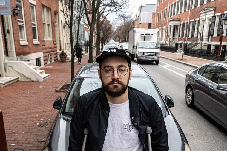 Robert Clendaniel is photographed near his car parked along Spruce street in Philadelphia, Pa. Friday, January 6, 2023. Robert is among new plaintiffs joining a potential class-action lawsuit against the city of Philadelphia for its longtime "courtesy tow" problem (basically when they tow your car even though it is parked legally and don't track where they dropped it off). Robert had a terrible experience getting it back.