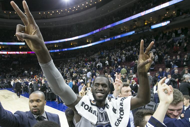 Villanova's Daniel Ochefu and teammates salute the student section after their 73-63 win over St. John's.