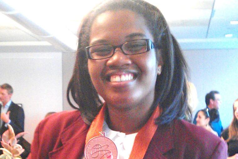 Gabrielle Carter, a junior at Girard College, the high school for low-income students in North Philadelphia, put her holiday wish on the school Christmas tree.