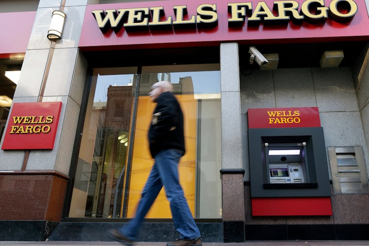 FILE - Wells Fargo ATM in Philadelphia. The bank, with one of the largest branch networks in the city, has been a target of elected officials in recent years but continues to do business with city government. (AP Photo/Matt Rourke, File)