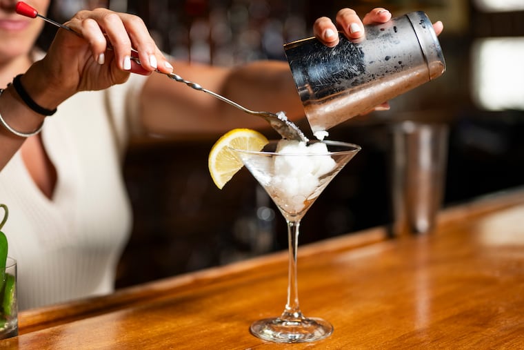 Gigi Bello, bar manager at Saloon, makes an Iceberg martini using lemon water from John's. The cocktail has remained a bestseller since they started serving it in 2002.